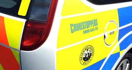 Police car with Crimestoppers logo