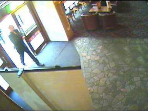 Suspect walks into bank brandishing knife