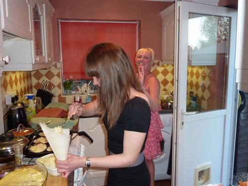 Karen and daughter Carly prepare the meal