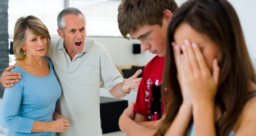 Parents scolding teenagers