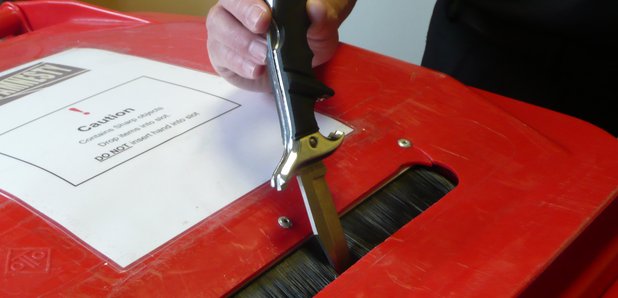 Knife being dropped into an amnesty bin