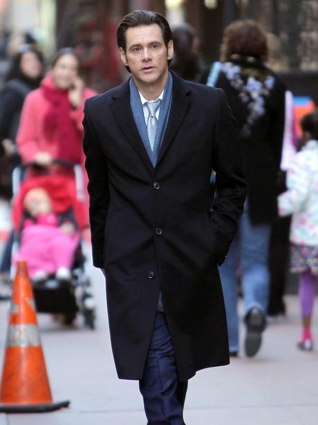 Jim Carrey walking down a street