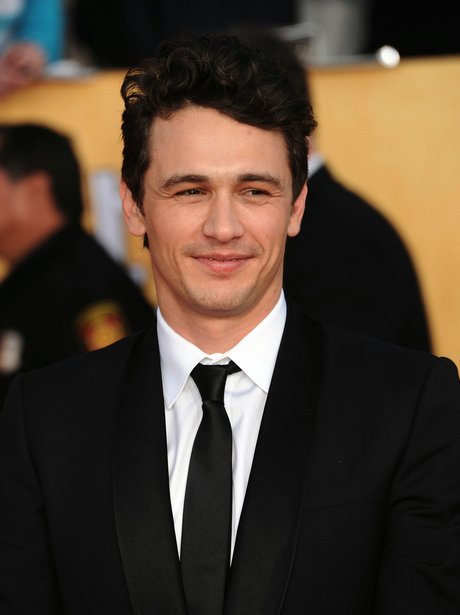 Cheeky chappy James Franco looks hot in a black tie and suit