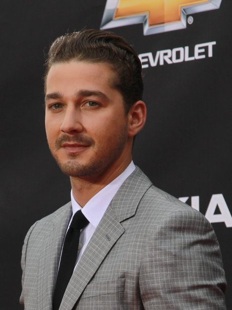 Shia LaBeouf as a grown man in a grey suit