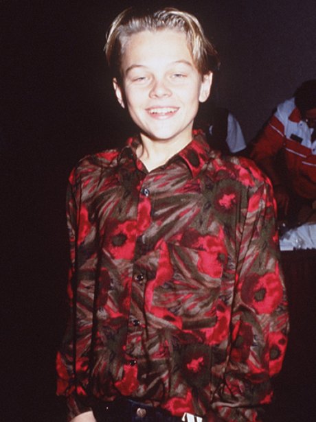 A young Leonardo DiCaprio in a red and brown shirt