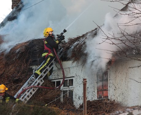 More than 100 tackle cottage fire
