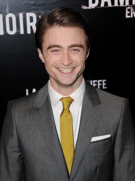 Daniel Radcliffe as a grown man in a suit