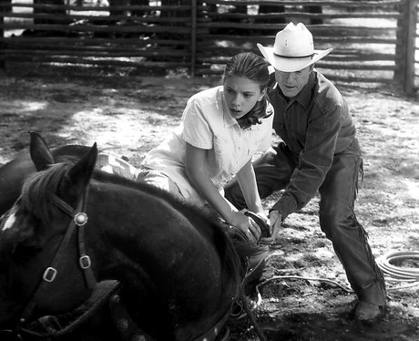 Scarlett Johansson tending to a horse
