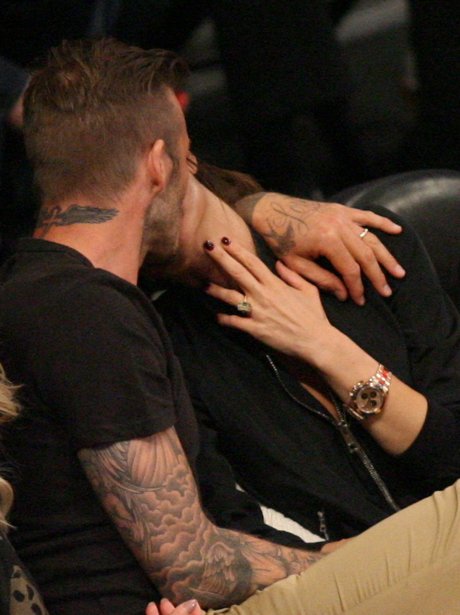 David and Victoria Beckham kissing