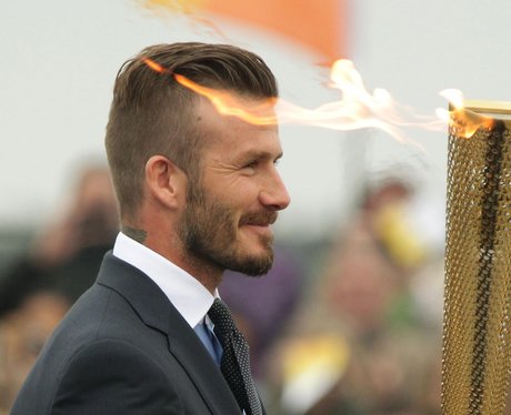 David Beckham with the Olympic Flame