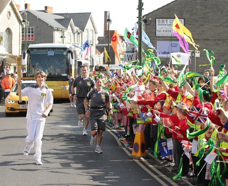Olympic Flame between Street and Coxley