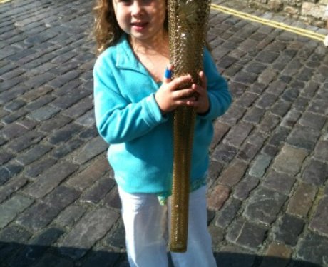 Bliss holidng the Olympic flame
