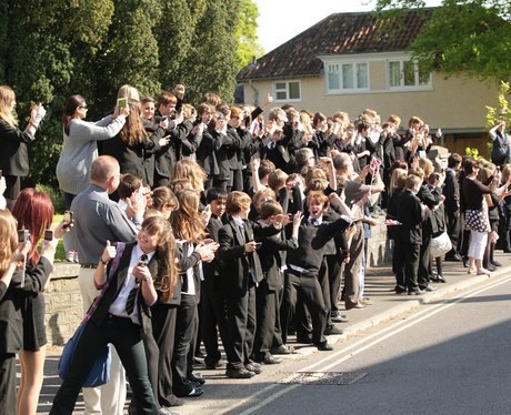 School children line the streets
