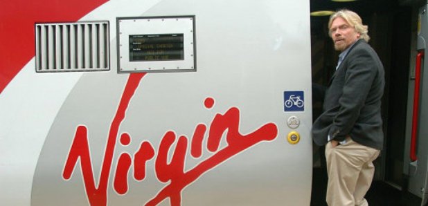 Sir Richard Branson boarding a Virgin Train