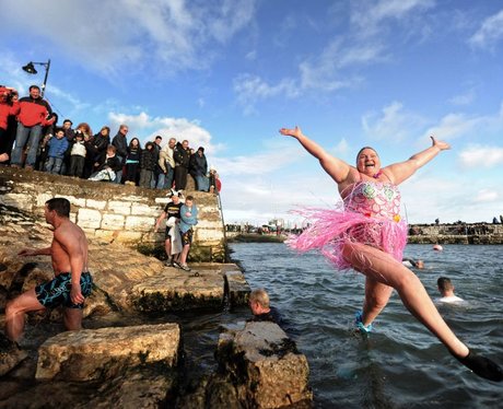 Woman jumping into the sea