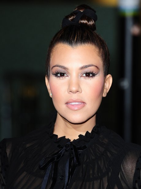 Kourtney Kardashian wearing a top knot