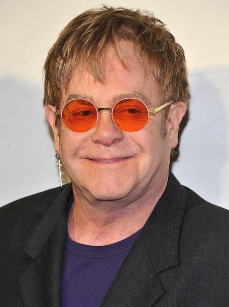 Elton in orange glasses