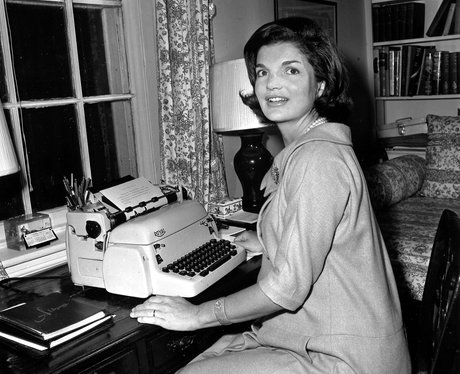 Jacqueline Kennedy poses at her typewriter 