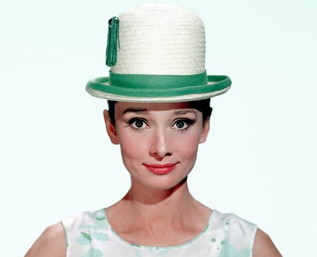 Audrey Hepburn in a green and white bowler hat