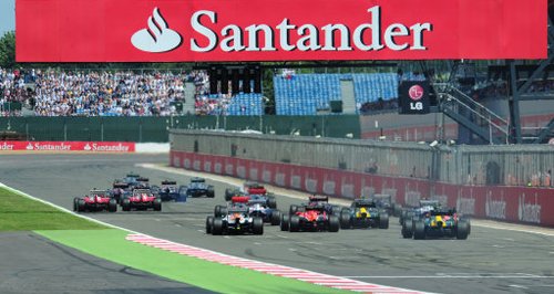 Cars move off the grid at the British Grand Prix.