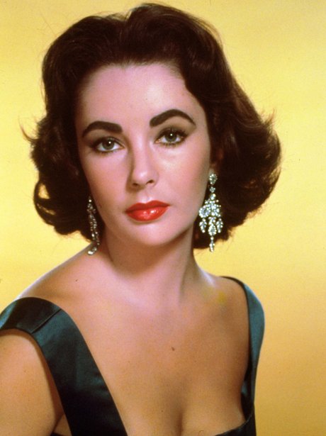 Elizabeth Taylor wearing diamond drop earrings