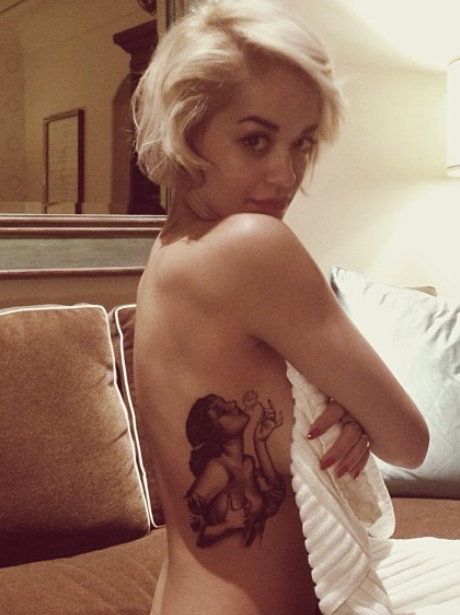 Rita Ora shows off her new tattoo