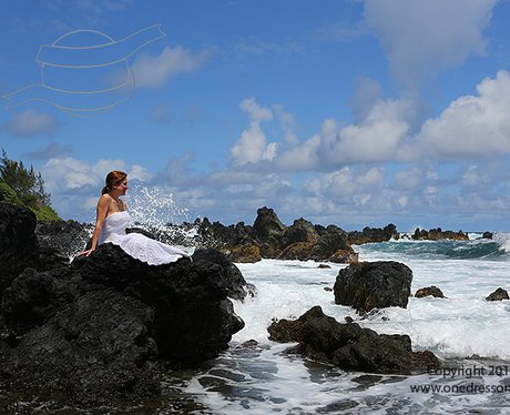 Woman posing around the world in her wedding dress