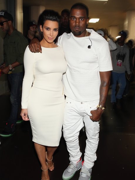 Kim Kardashian and Kanye West dressed in white