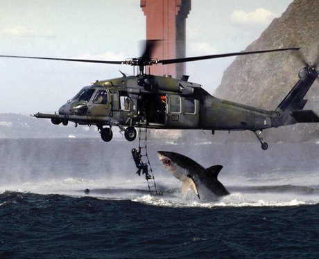 shark jumps up towards a helicopter