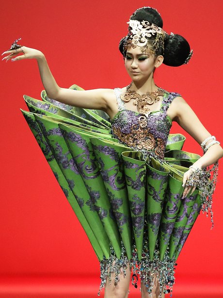 a model in a green couture dress