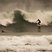 Image 3: surfer rides a wave in cornwall