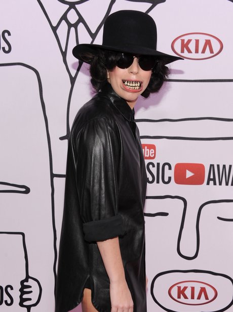 Lady Gaga wearing grills and a black shirt