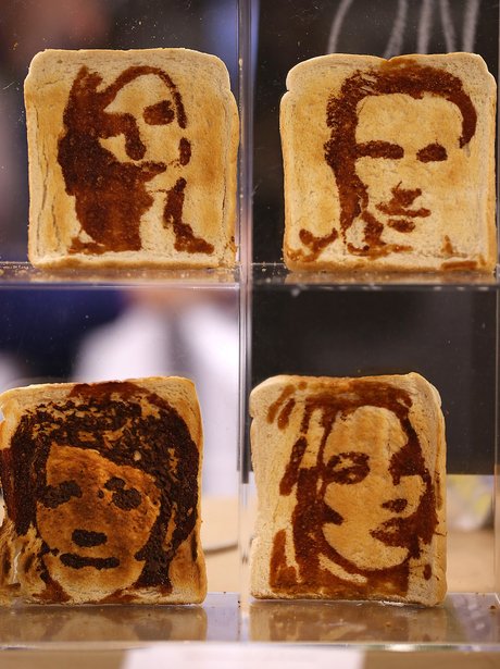 Pieces of toast with celebrities drawn in marmite on them in the Experimental Food Society Exhibition 