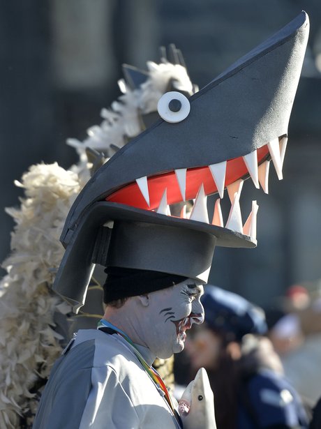 A man dressed as a shark forms part of the Hoppeditz parade