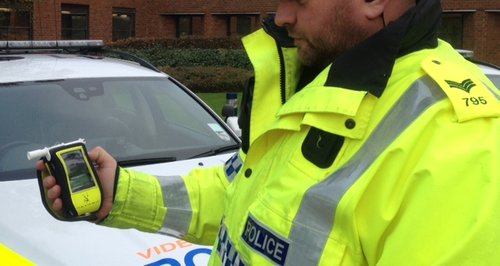 Policeman With A Breathalyser 