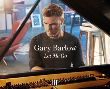 Gary Barlow plays piano