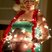 Image 6: A person wrapped in christmas lights