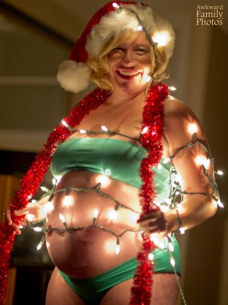 A person wrapped in christmas lights