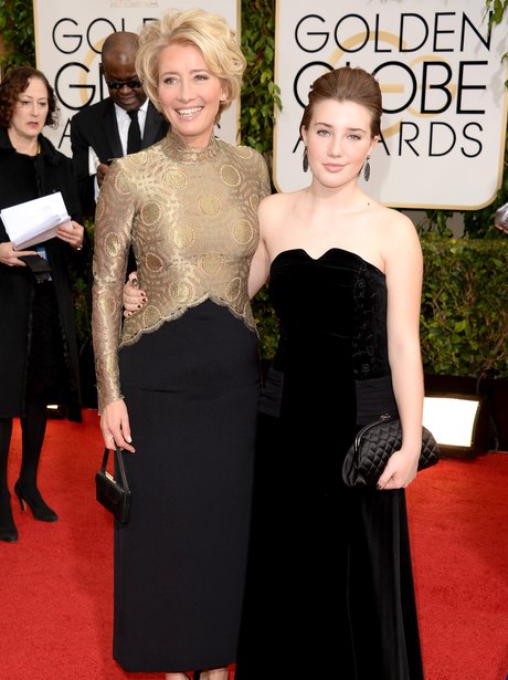 Emma Thompson in a gold and black dress with daughter Gaia