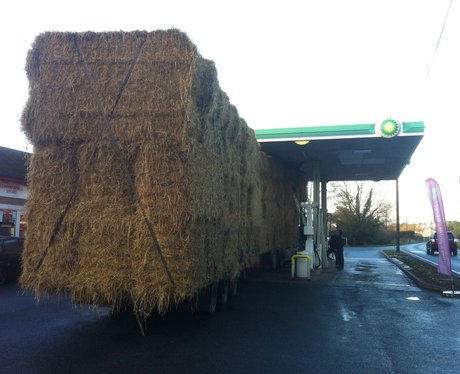 Lorry carrying some hay crashes in to station