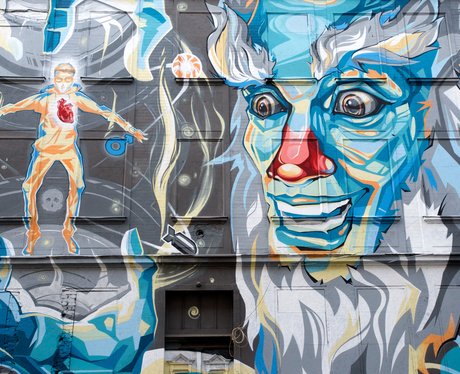 A surreal graffiti art work of a face