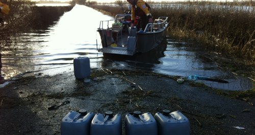 Fuel loaded on boat in flooded Somerset
