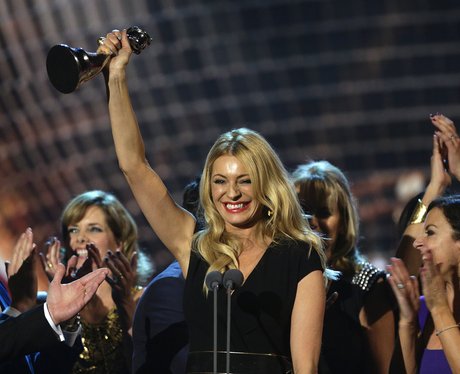 tess daly holding an award