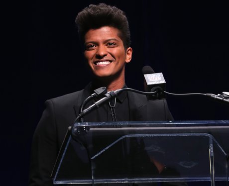 Bruno Mars speaking on stage