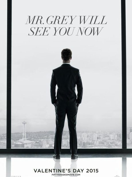 jamie dornan as christian grey looking out of a window