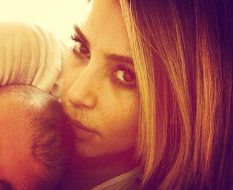 Kim Kardashian hugging baby