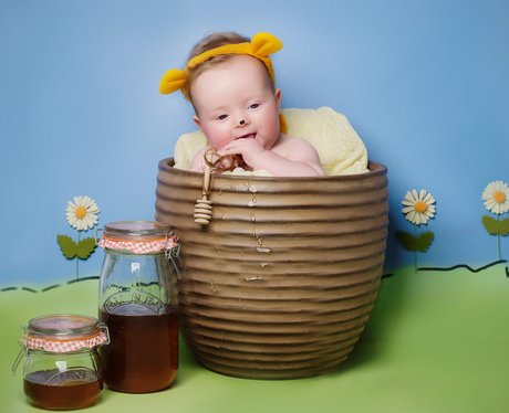 A baby dresses as Winnie The Pooh