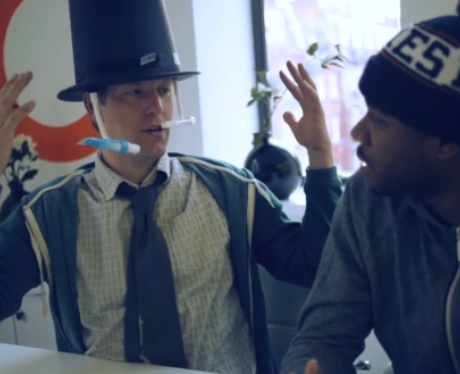 A man in a toothbrush top hat
