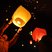 Image 5: Lit Chinese lanterns in the night sky