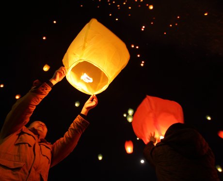 Lit Chinese lanterns in the night sky